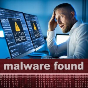 Lab worker at computer screens that identify system hacked and malware found